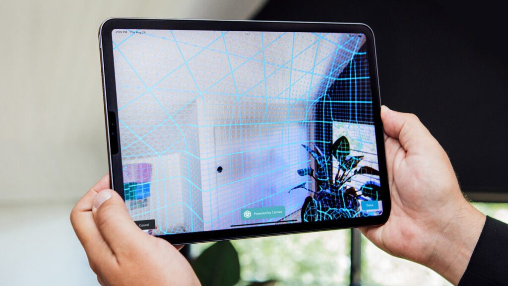 hands holding ipad